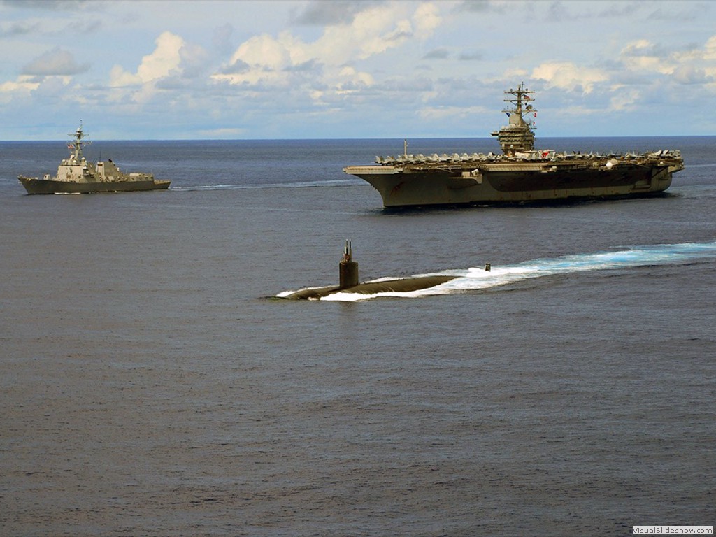 USS Hampton (SSN-767) steams in front of Kitty Hawk, CV-63, 2007.